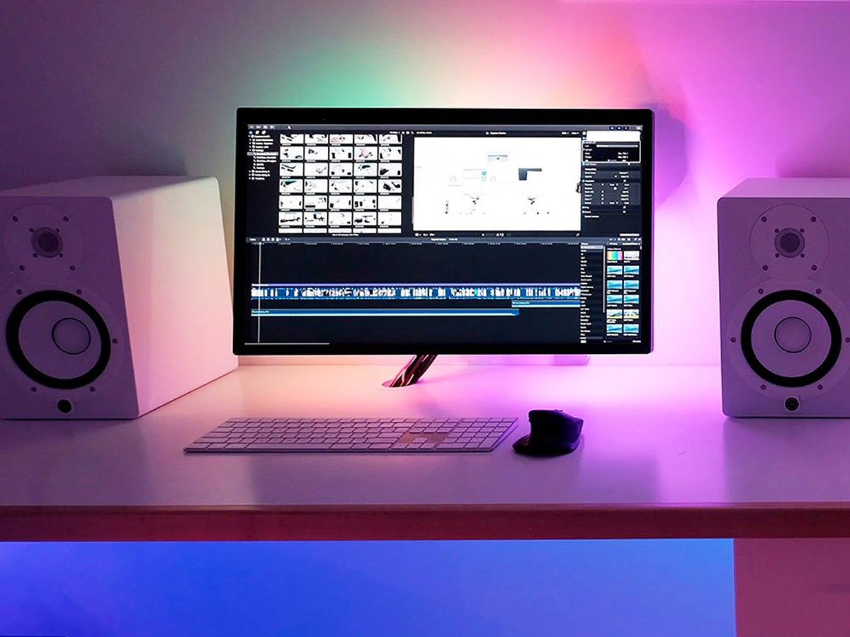 desk lit up with different colors including pink and blue