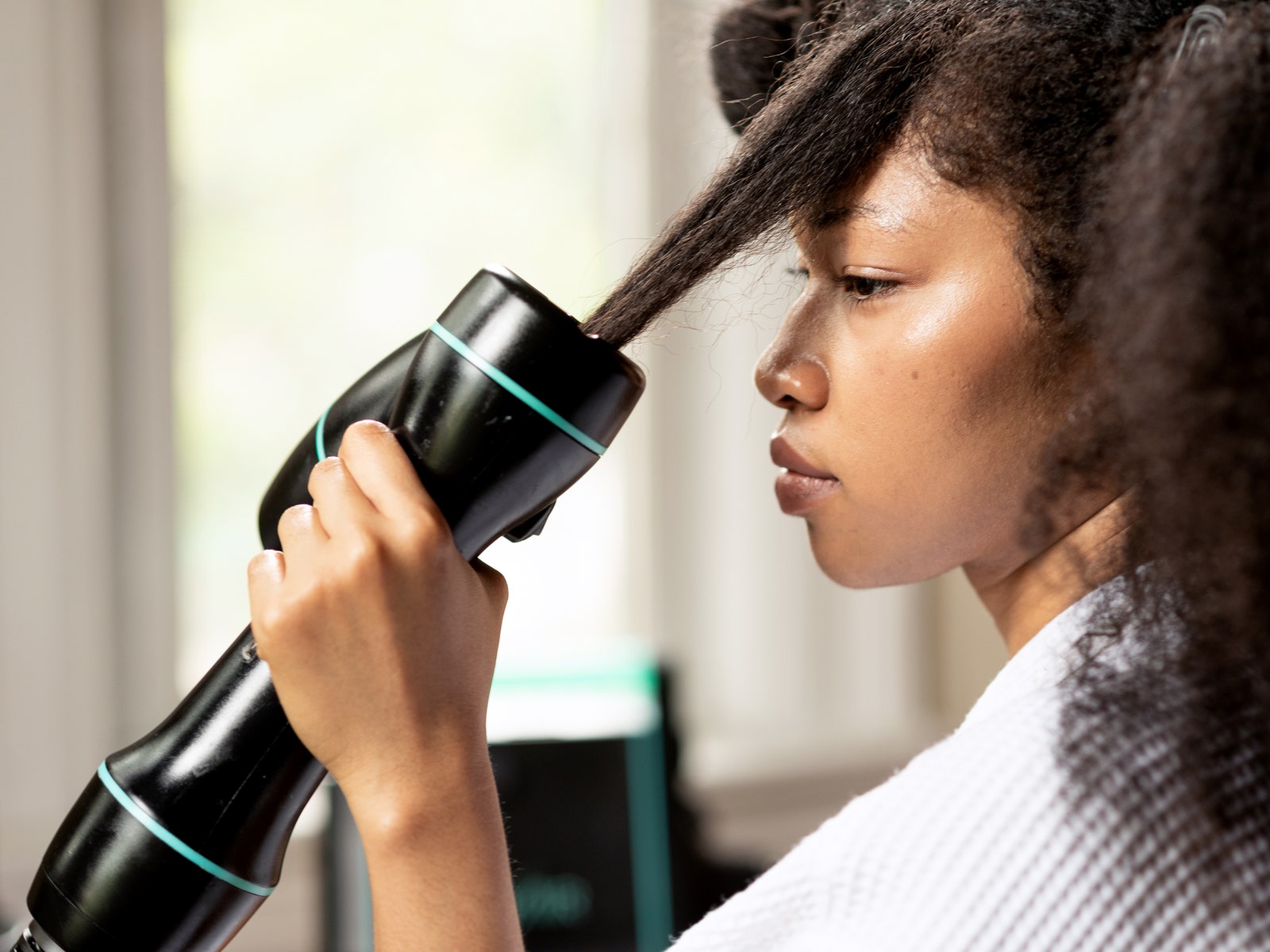 Woman using RevAir Hair Dryer