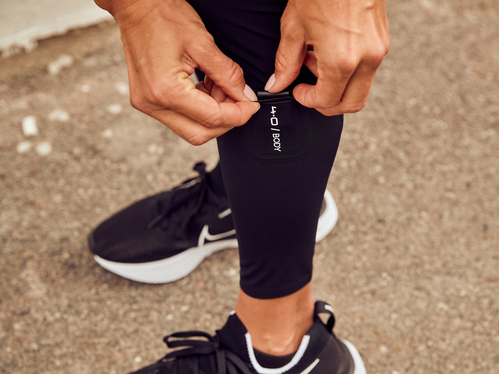 person inserting WHOOP into sock